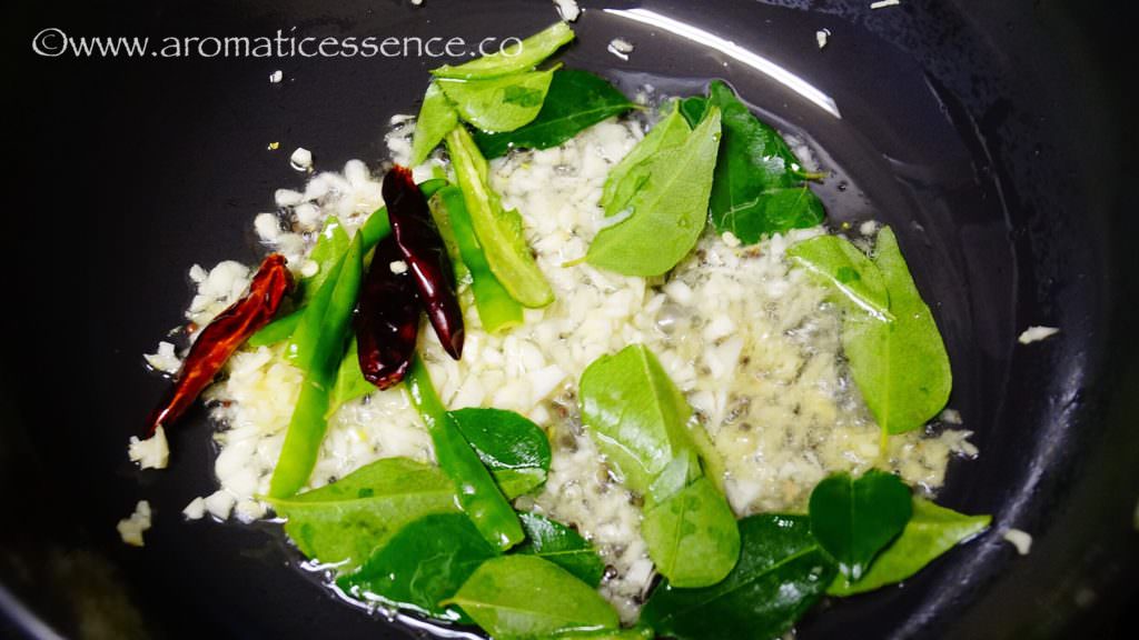 add mustard seeds, when they splutter add minced ginger, garlic, slit green chillies, and curry leaves. 