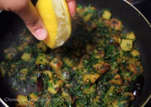 Next, add ground coriander, red chilli, and amchur powder (if using), mix well.