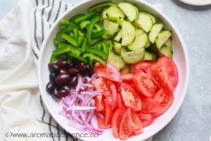 Veggies and olives for Greek salad in a shallow bowl