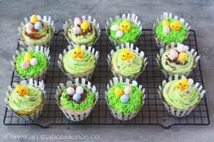 easter cupcakes topped with chocolate eggs and chick toppers