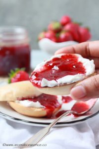 bagel with cream and strawberry jam