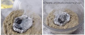 Pour oil over the hot charcoal