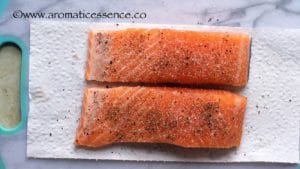 Season both sides of salmon.