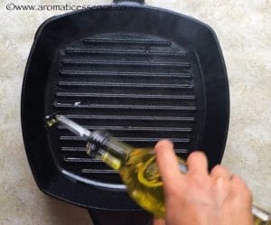Drizzle oil in a cast iron grill pan.