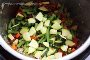 Add diced zucchini and green beans.