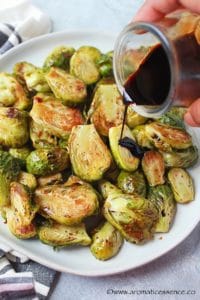 Drizzle the balsamic glaze all over the roasted brussels sprouts.
