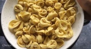 Add fresh cheese tortellini