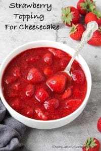 Fresh strawberry topping in a white bowl.