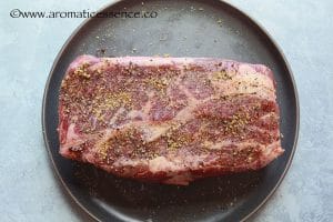 Salt and pepper one side of the chuck roast