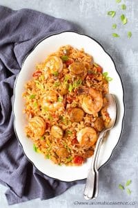 Sausage and shrimp jambalaya served in a white oval platter