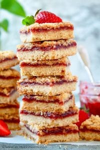 Close up shot of strawberry jam bars stacked