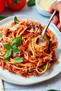 Instant Pot spaghetti served on a white rimmed plate