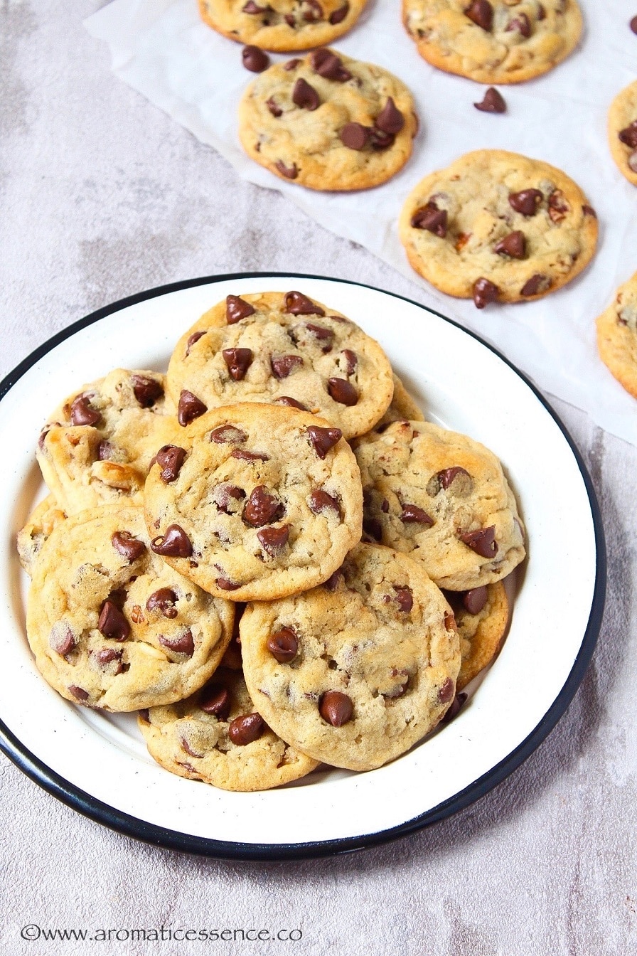 Egg-free chocolate chip cookies on a white plate.