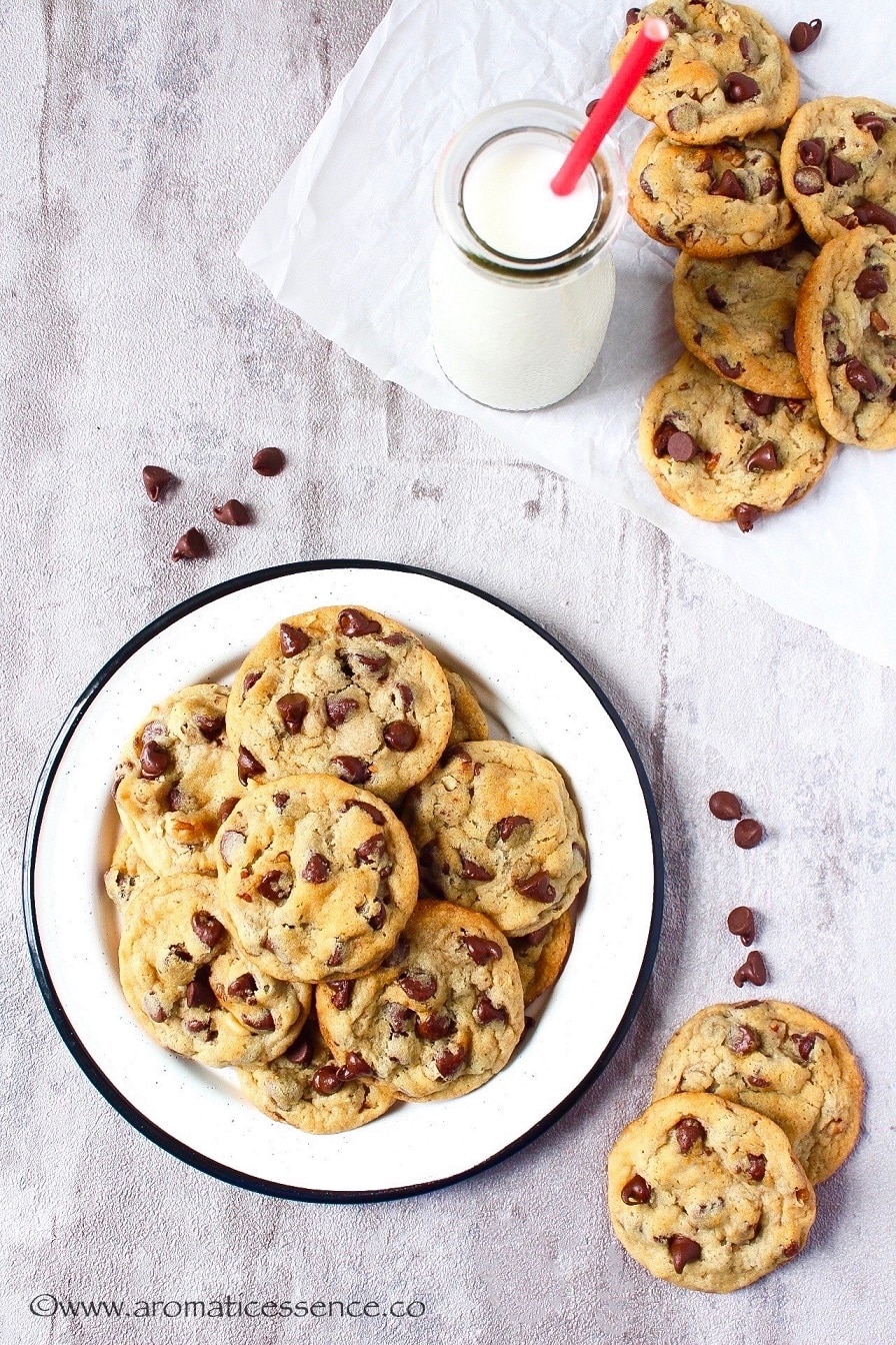 Chocolate chip cookies on a rimmed plate.
