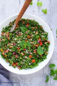 Lebanese tabbouleh in a white shallow bowl.