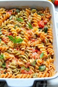 Tomato feta pasta in a white baking dish
