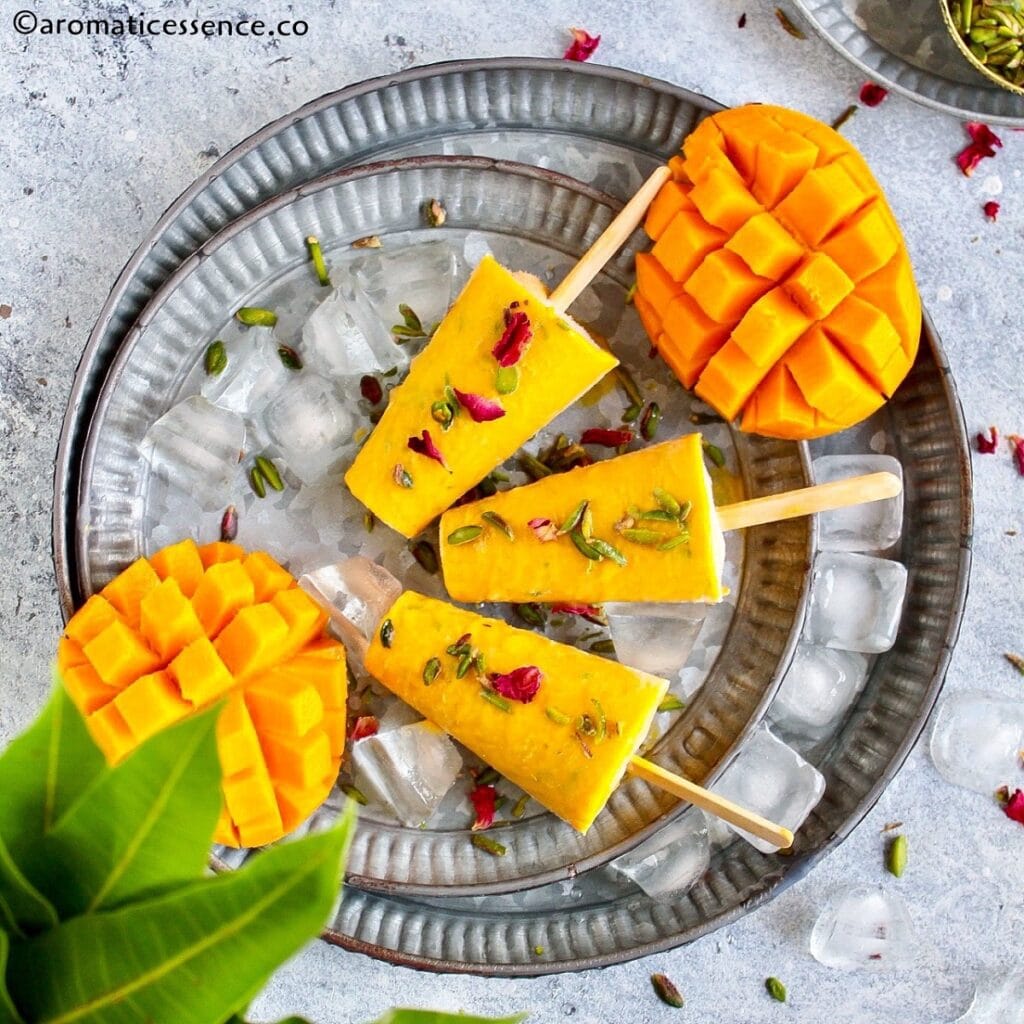 Homemade mango kulfi served in galvanized metal tray