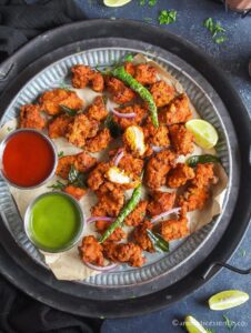 Overhead shot of chicken pakodi showing the interior of the pakoras