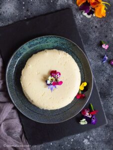 Block of khoya garnished with edible flowers