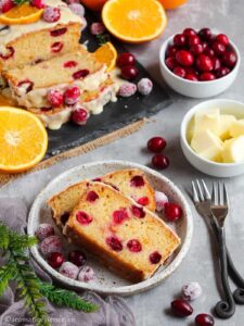 Two slices of fresh cranberry orange loaf in a plate