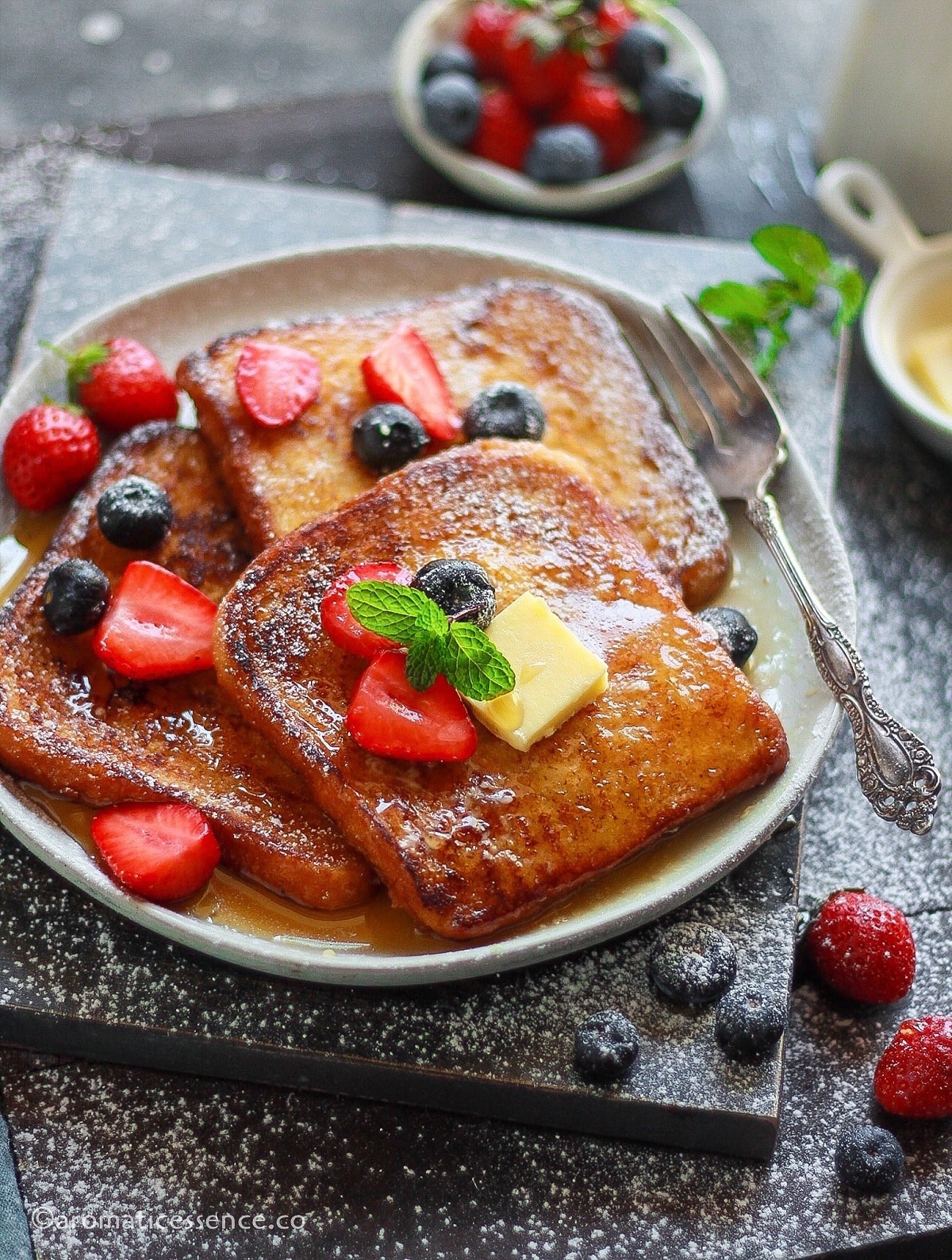 Close-up shot of no-egg French toast served on a white plate