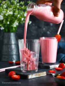 Pouring lassi in a glass