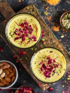 Overhead shot of kesar thandai served in two glasses