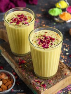Thandai served in 2 ribbed glasses
