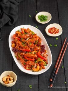 45 degree angle shot of dragon chicken served in a white oval platter