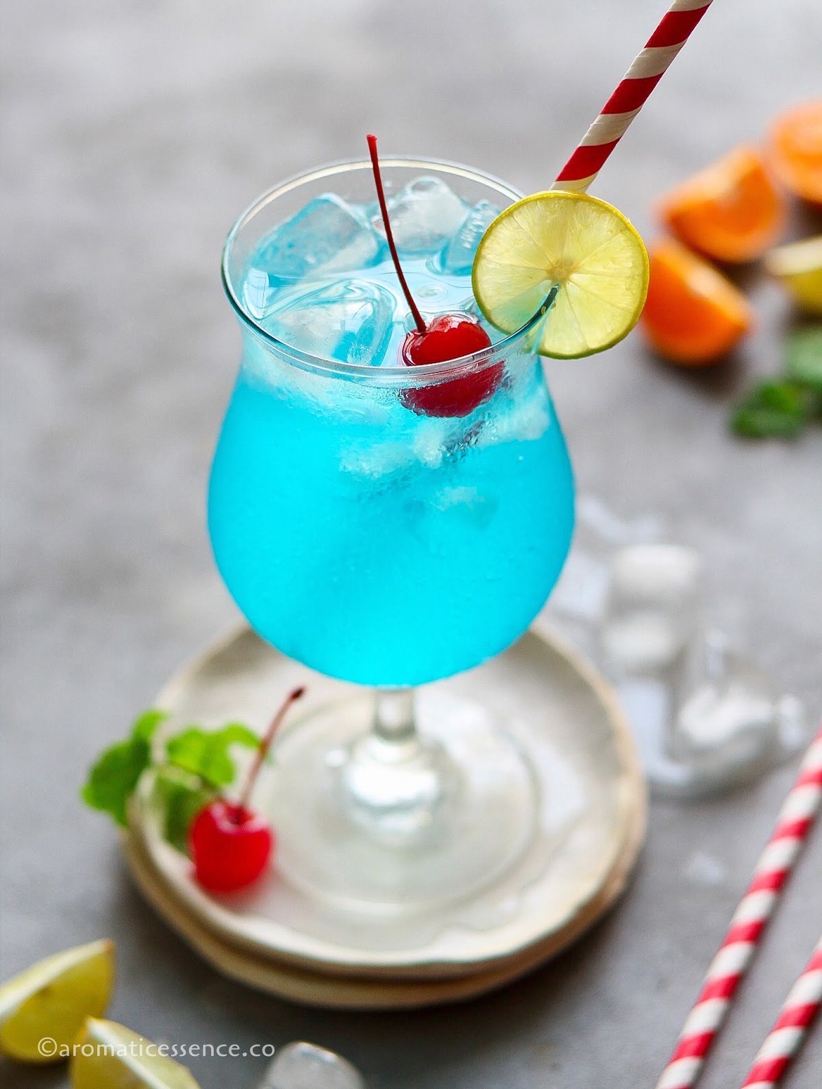 Blue lagoon mocktail served in a hurricane glass