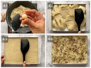 Coconut mixture transferred to a tray and packed firmly. Burfi garnished with pistachios and dried rose petals