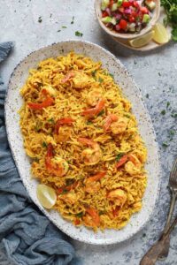 Prawn pulao served on an irregular speckled tray